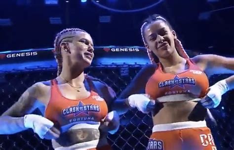 Female fighters flash breasts to crowd following tag team MMA。